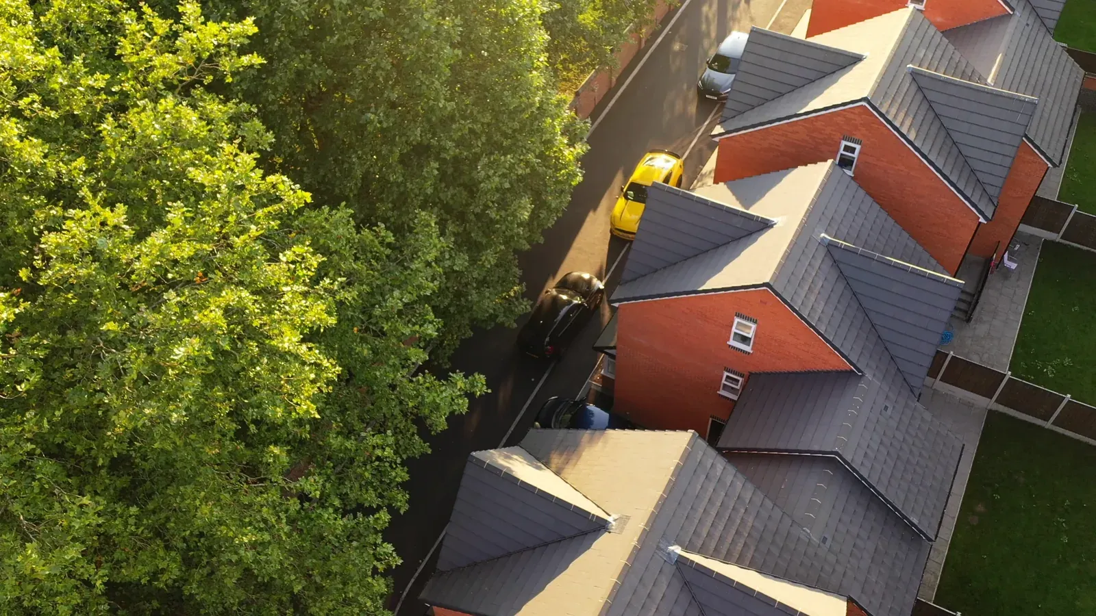 Aerial view of a row of completed pitched roofs on a residential complex