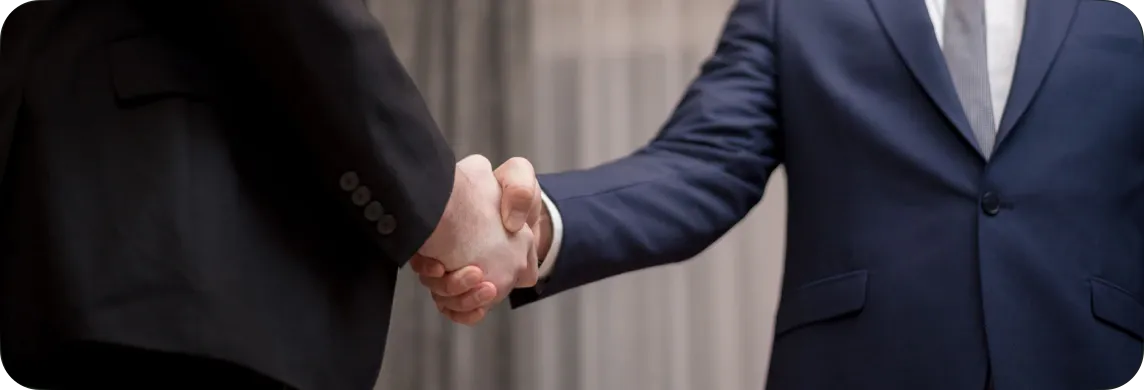 A handshake confirming an approved project